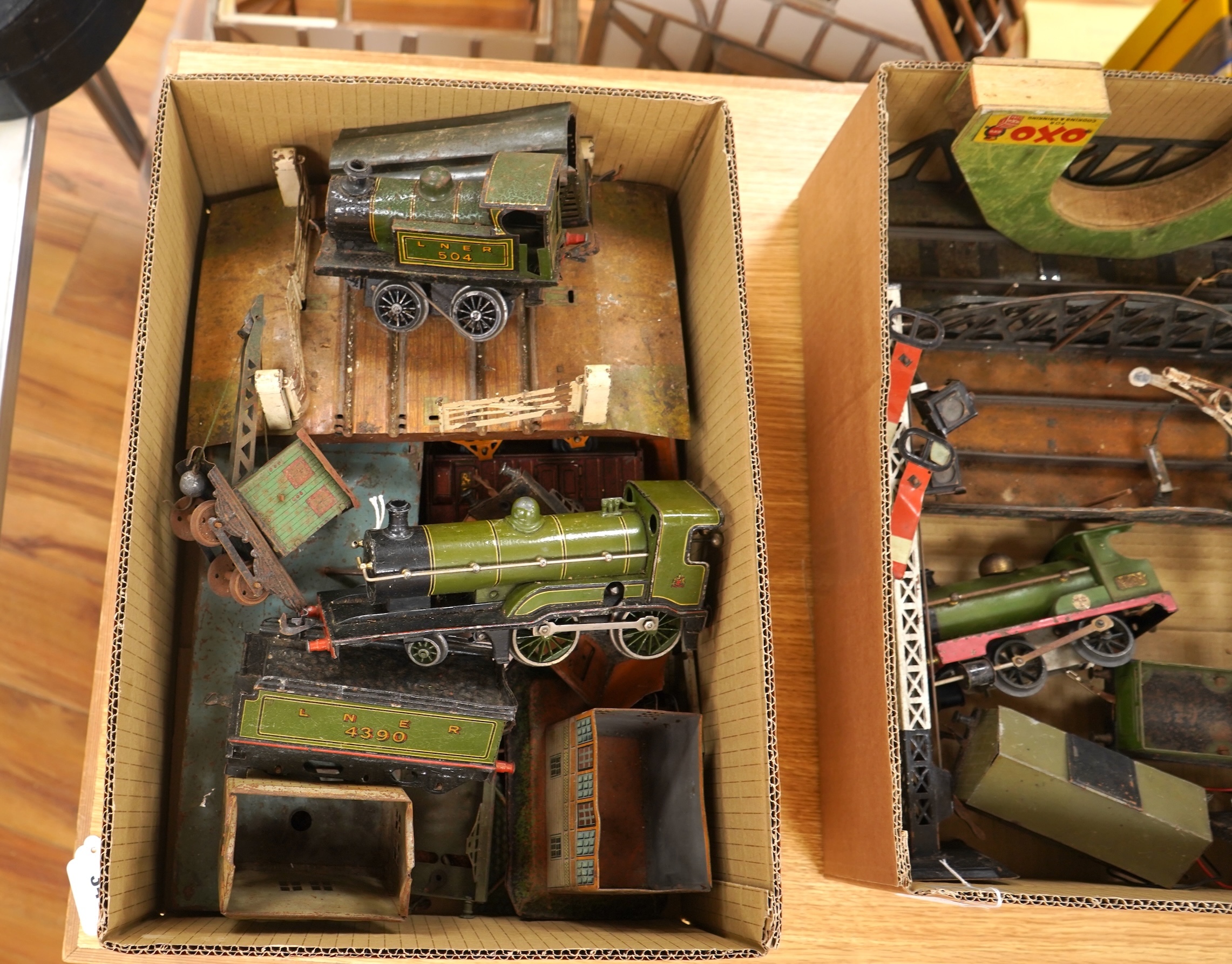 A Bing for Bassett Lowke 0 gauge tinplate clockwork LNER Ivatt 4-4-0 tender locomotive, 4390, together with an early Hornby clockwork 0-4-0, 2710, in GNR green livery with Meccano Ltd roundels to locomotive splasher and